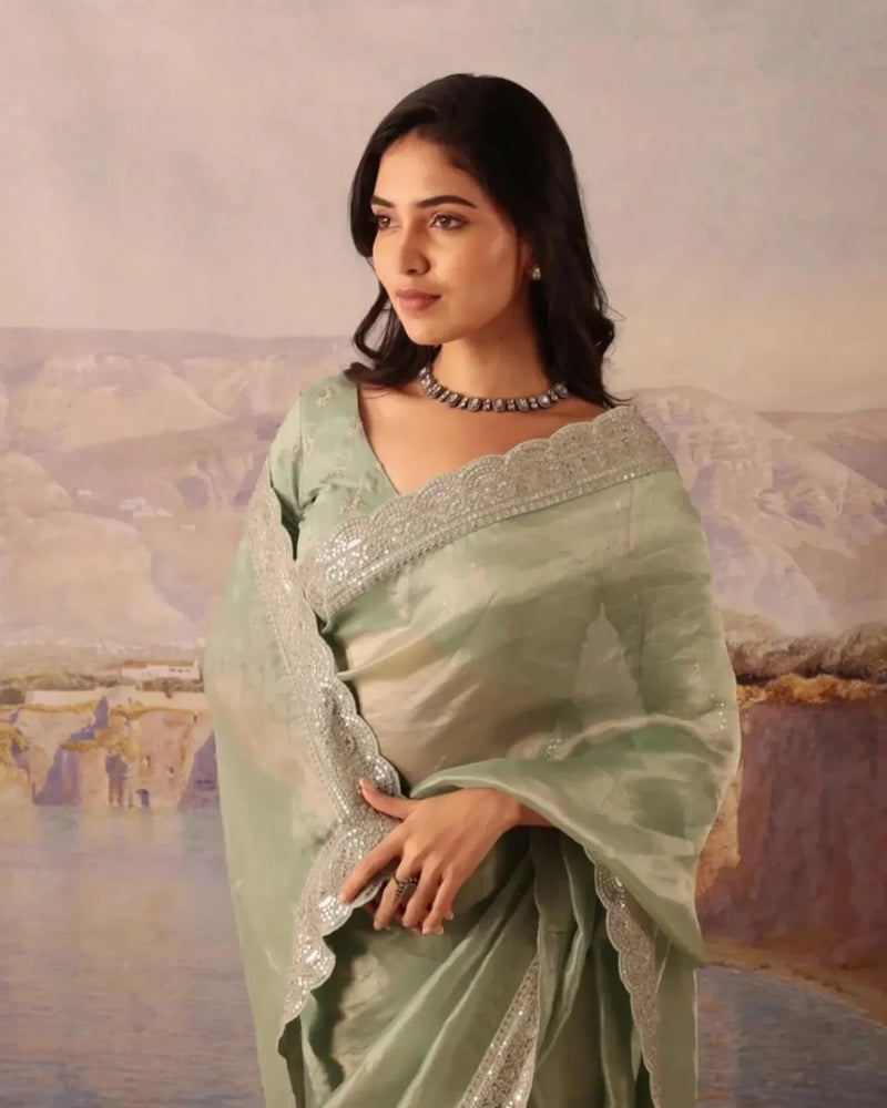 Mint green silk saree with gold sequin lace yoke and matching blouse