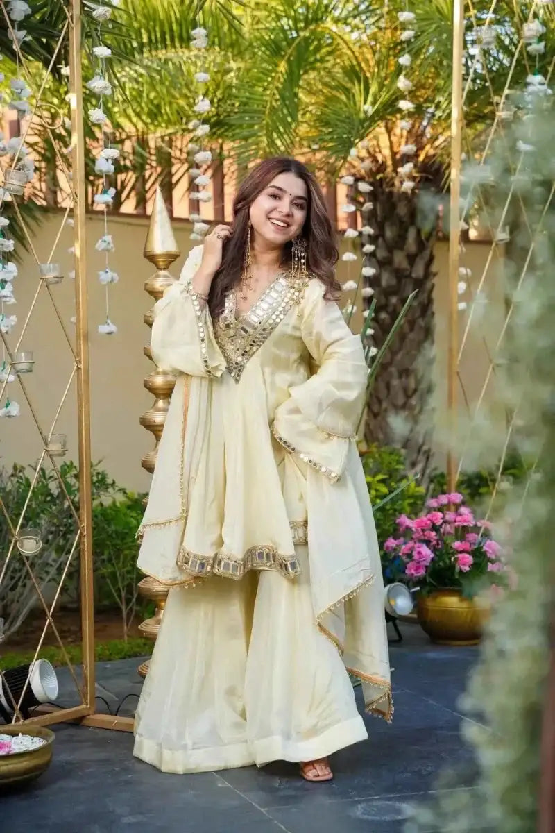 Off-white mirror-work silk anarkali kurti and palazzo set with decorative cuffs