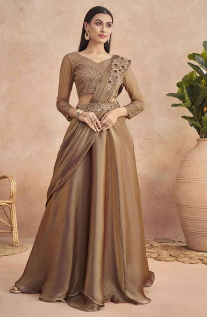 Mocha-brown drape saree with gold belt and ornate shoulder embellishment