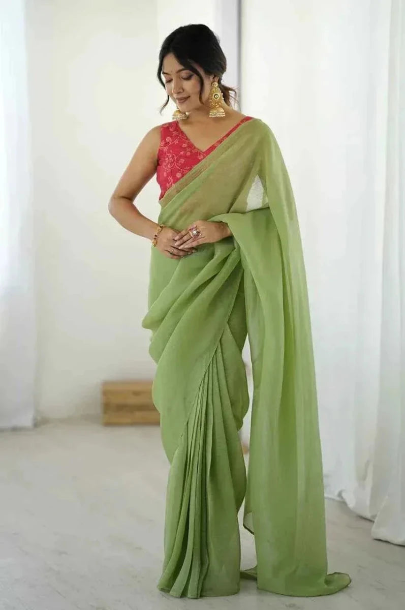 Green silk saree with red embroidered blouse and draped pallu