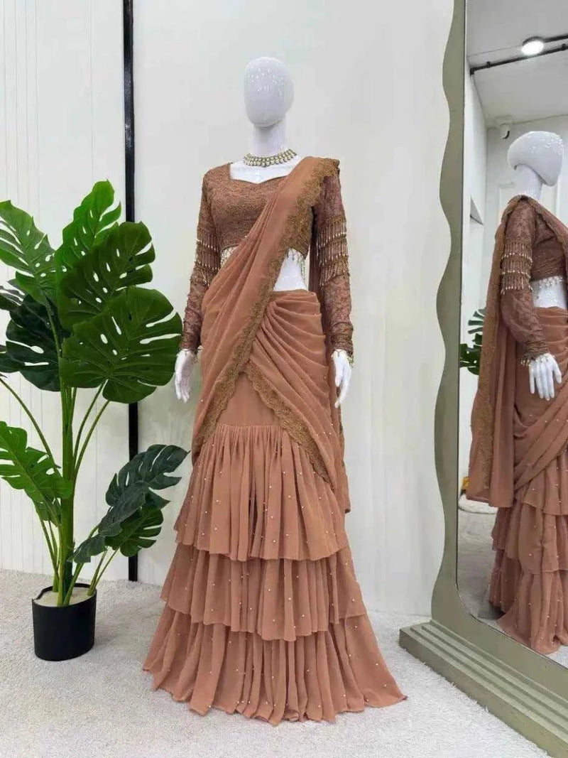 Nude peach ready-to-wear ruffle saree with long-sleeve sequin blouse and tiered pleats