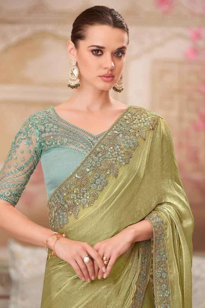 Olive-green saree with gold-embroidered edge on aqua-patterned blouse-style panel
