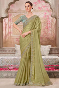 Olive-green satin silk saree with gold embroidered border and pallu, draped on model