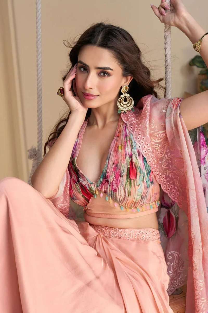Pink floral bralette set with colorful tassel trim, sheer dupatta and draped pants