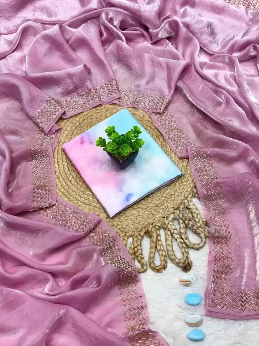 Lavender tissue saree with gold fringe border and beaded decorative pouch.
