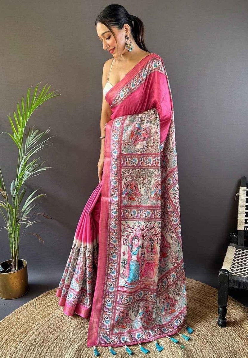 Pink tussar silk saree with ornate paisley-style print and pallu border, side view