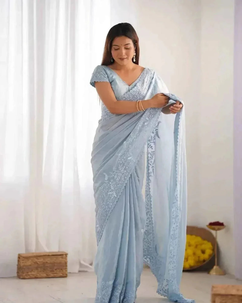 Powder blue crushed tissue saree with silver sequin border and draped pallu