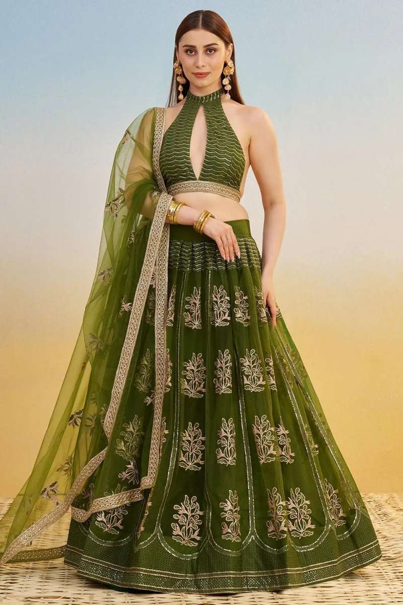 Green embroidered lehenga set with halter crop top, flared skirt, and dupatta