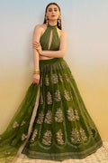 Green embroidered lehenga set with halter crop top and flared skirt