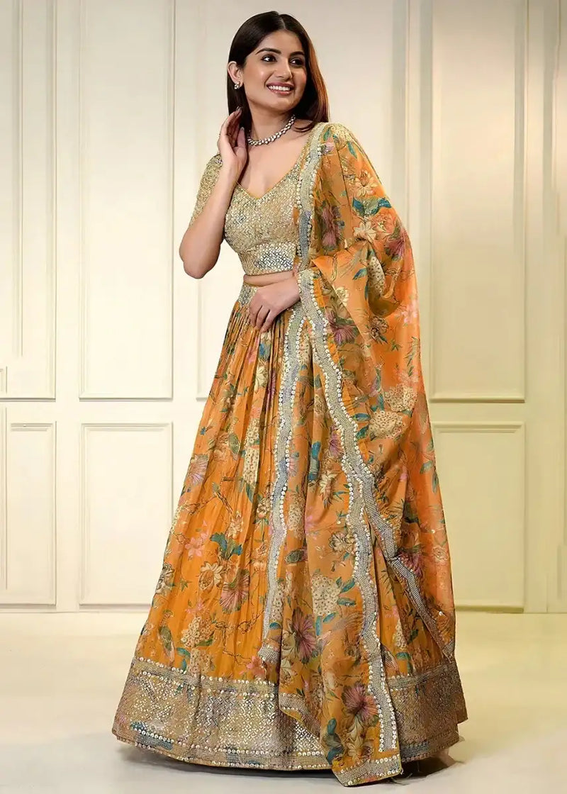 Lehenga set: gold and orange floral lehenga skirt with flared pleats and matching dupatta