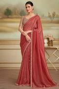 Red embroidered saree with sheer brown blouse and lace-trim border on pallu