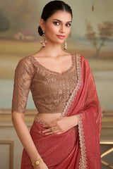 Maroon-red saree with cream embroidered border, sheer lace blouse, and draped pallu