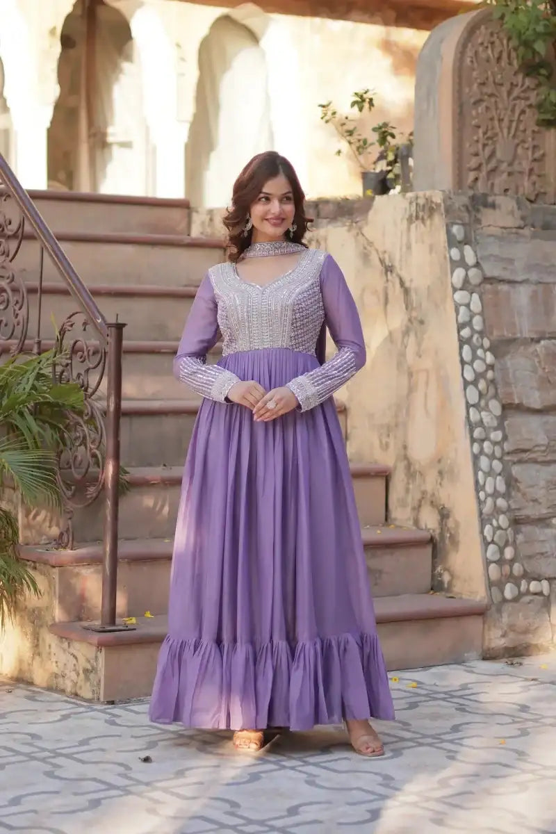 Purple embroidered gown with sequin bodice, long sleeves and ruffled hem