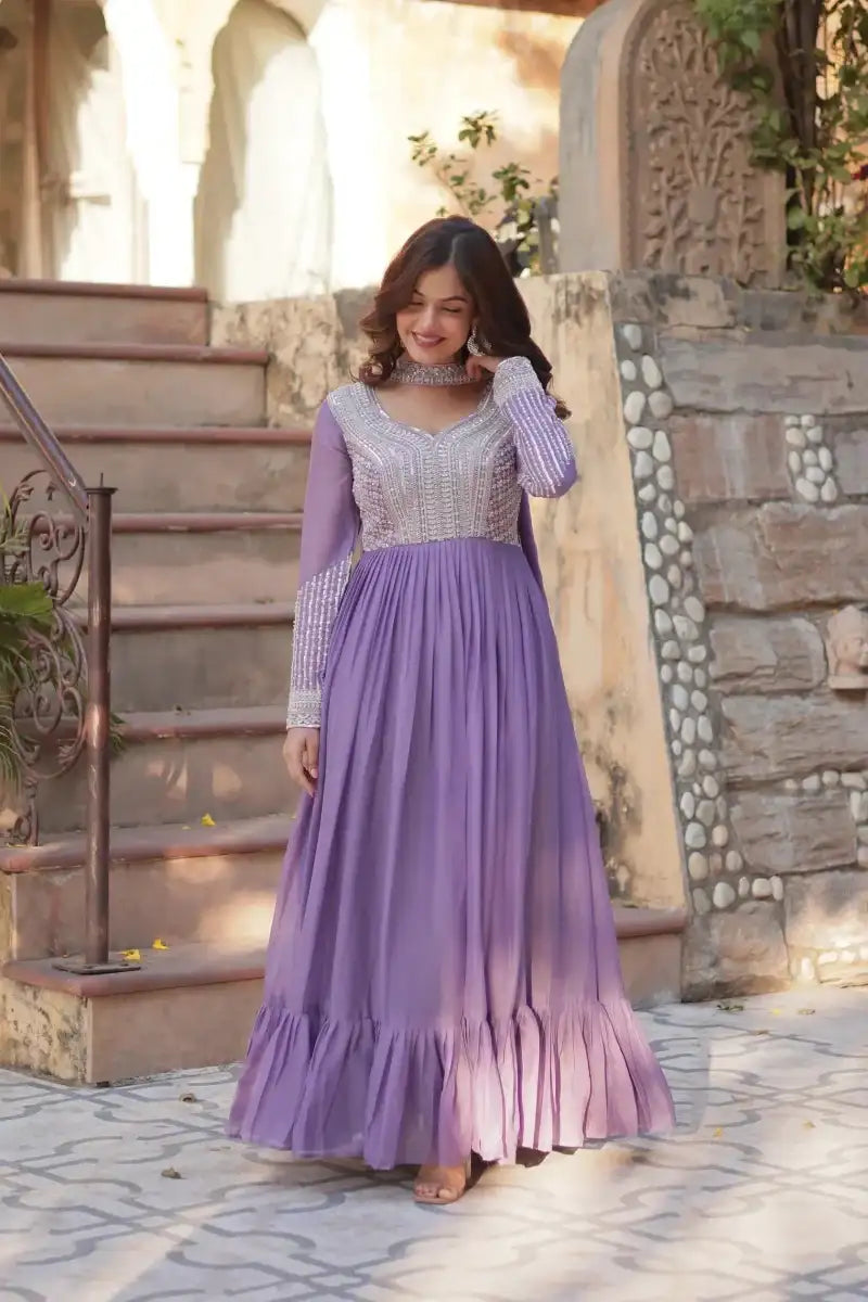 Purple embroidered sequin gown with long sleeves and tiered skirt