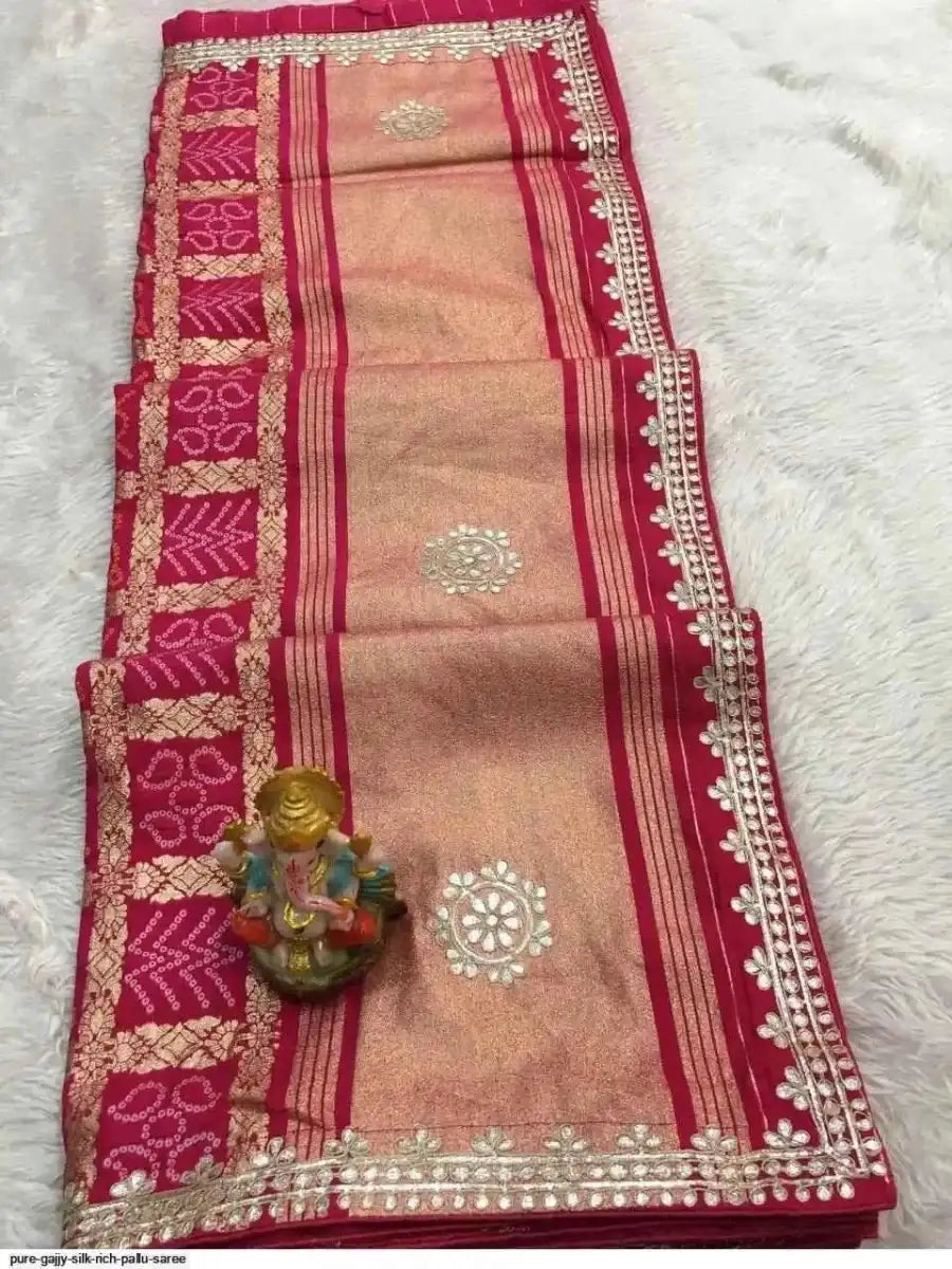Beige and magenta silk saree with vertical stripes, gold gota patti border and pallu
