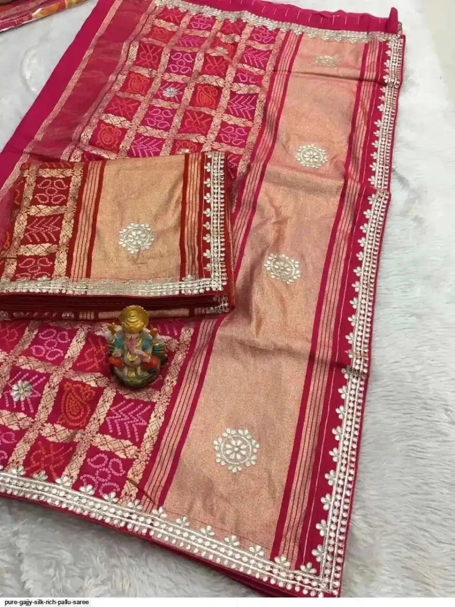 Beige silk saree with magenta checks and striped pallu, trimmed with gota border
