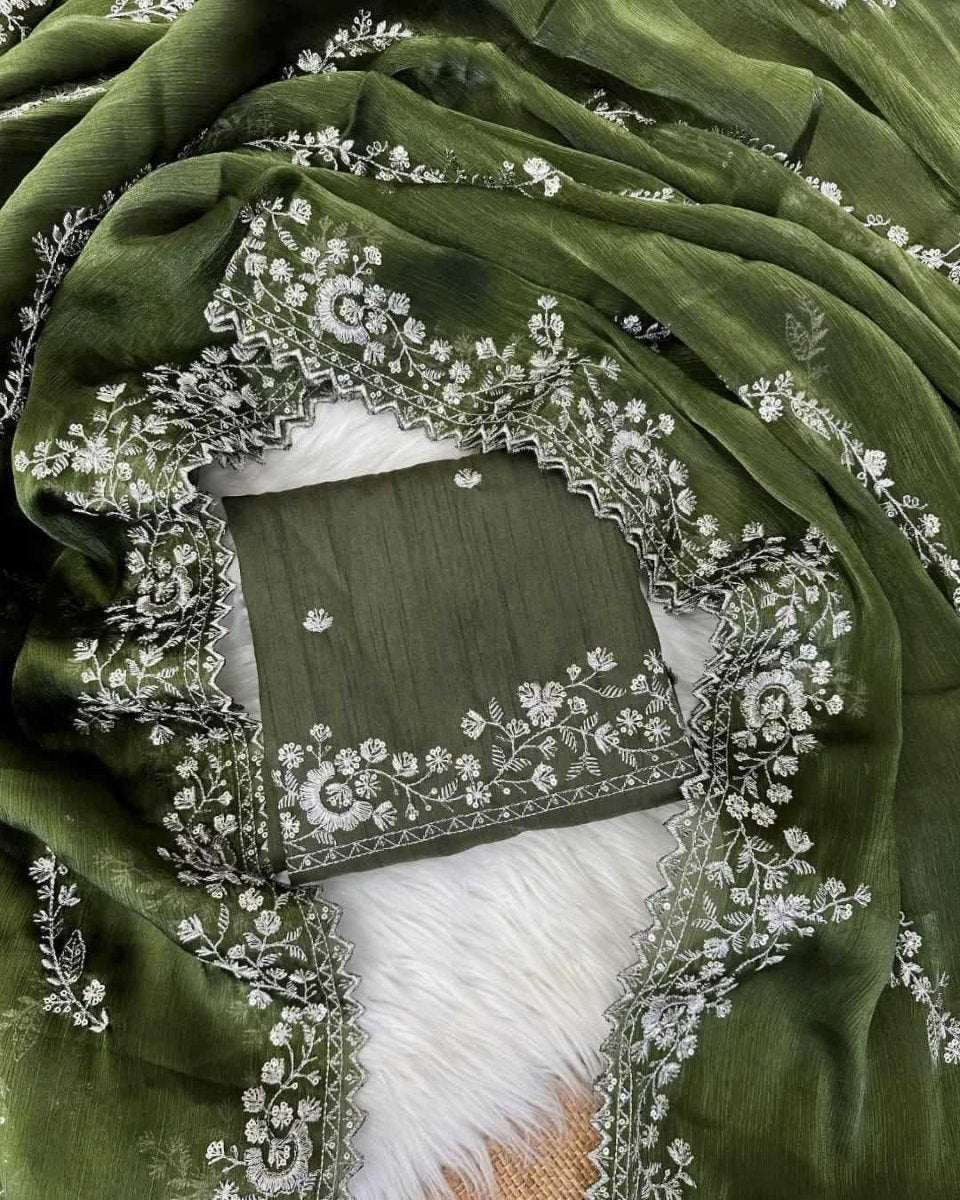 Olive green silk saree with white floral embroidery border and pallu drape
