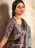 Purple satin crepe saree with abstract floral and geometric prints, draped on model