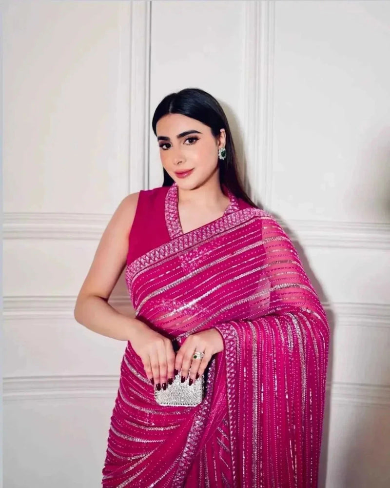 Pink sequined saree with embellished pallu and dori work, shoulder drape