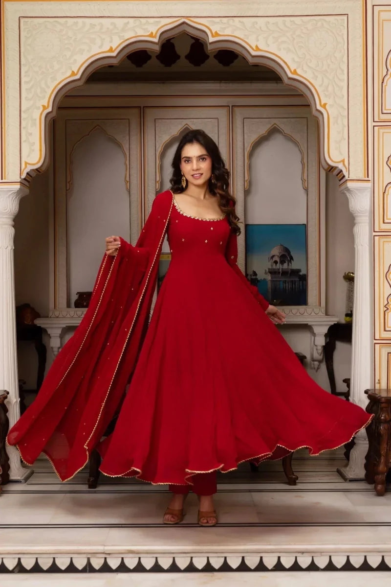 Red sequin anarkali suit with flowing skirt and draped dupatta, long sleeves