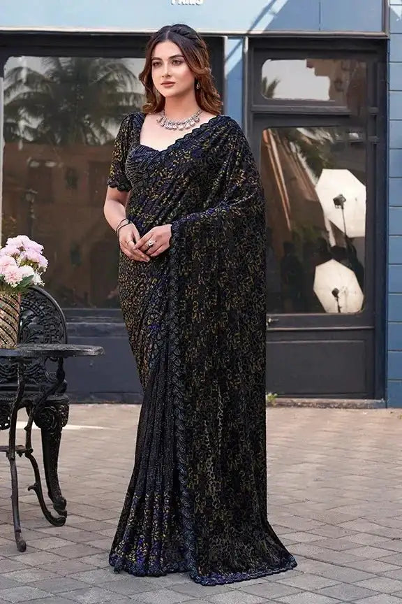 Dark velvet saree with gold beadwork, short puff sleeves, full-length drape