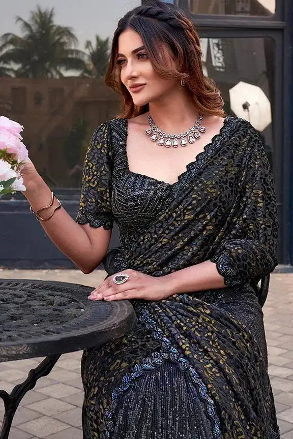 Dark velvet saree with gold beadwork, square neckline, elbow-length sleeves