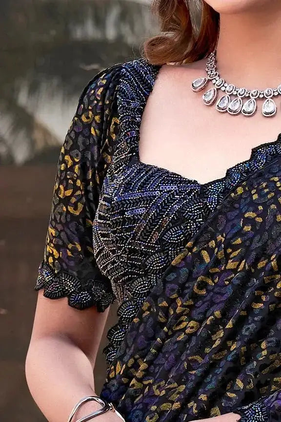 Bead-work velvet saree set with scalloped neckline and dark base, gold motif sleeves