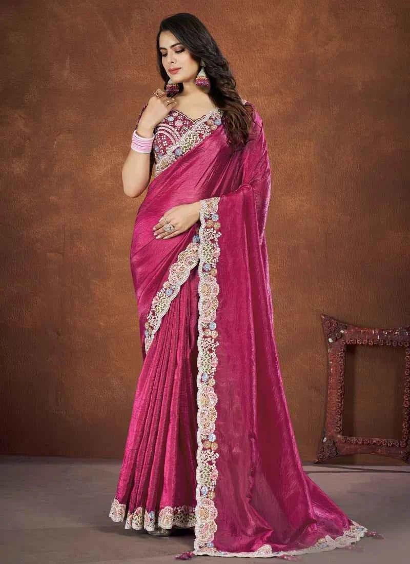 Rose pink silk saree with decorated pallu and gold-cream border with tassels