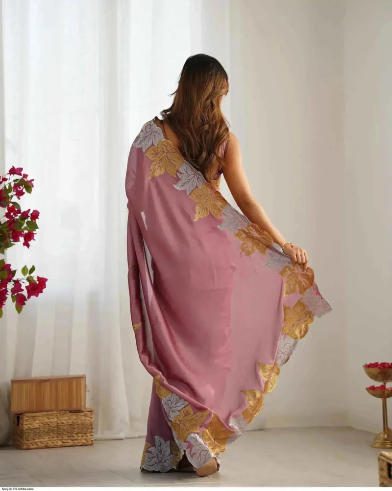 Rose pink saree with floral embroidery pattern, shown from back drape