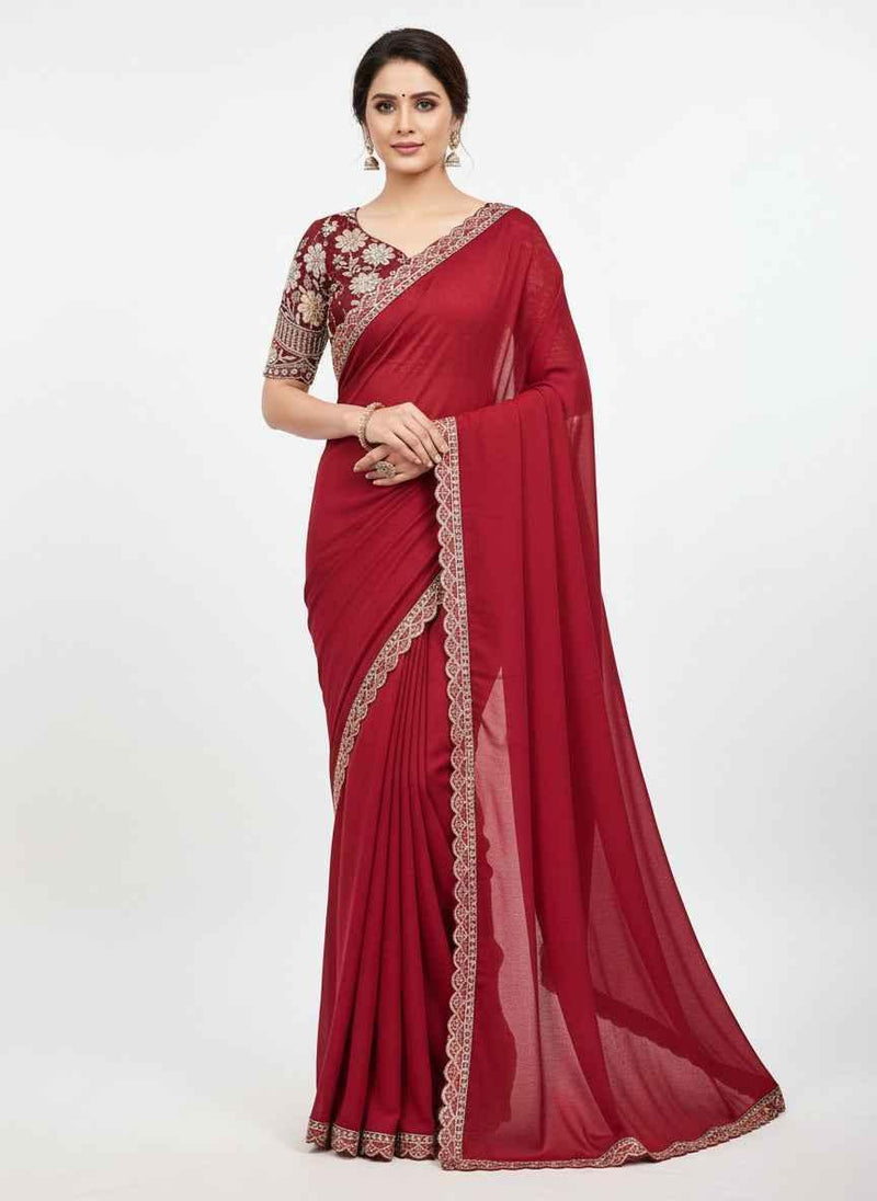 Red georgette saree with ornate embroidered border and matching blouse