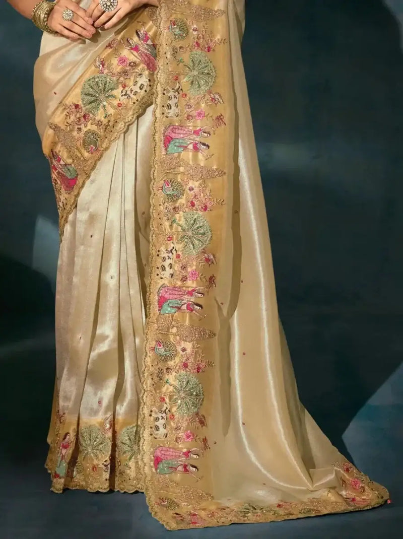 Golden cream saree with long embroidered border and multicolor peacock floral motifs