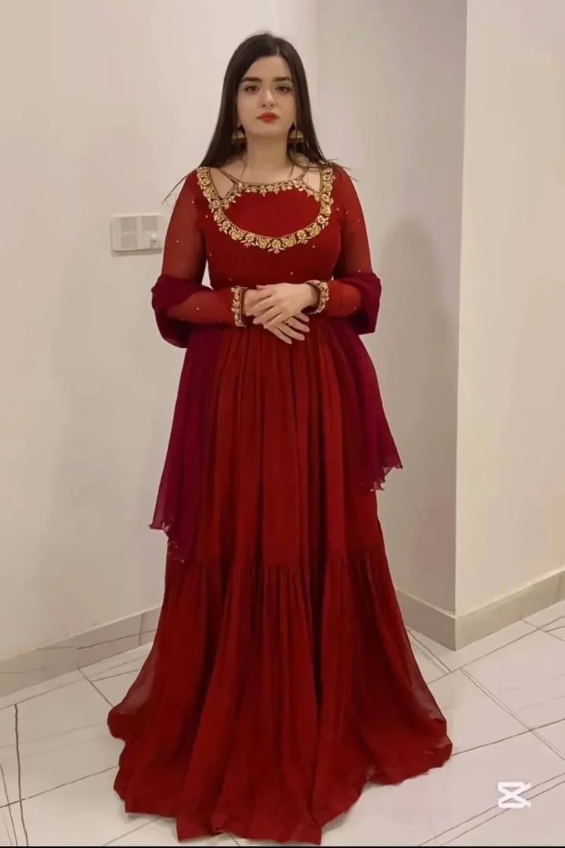 Ruby red designer flare gown with gold embroidered yoke, long sleeves, tiered skirt