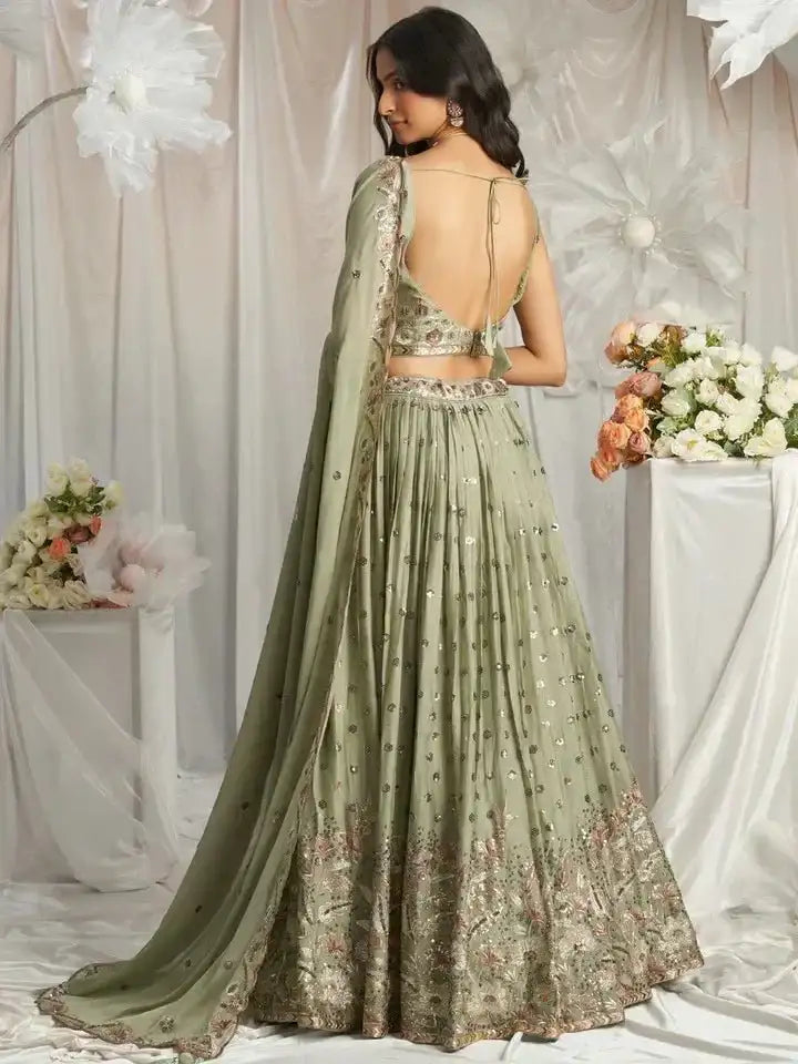 Sage green lehenga with back keyhole sequin blouse and tiered flared skirt