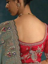 Sage green saree pallu detail with ornate embroidered panel and scalloped gold edge