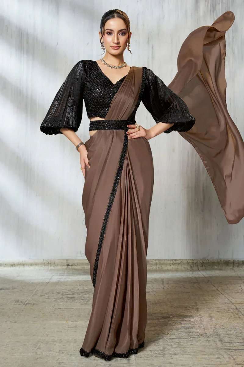 Ruffle saree full view: black sequined blouse with flared sleeves and taupe pallu