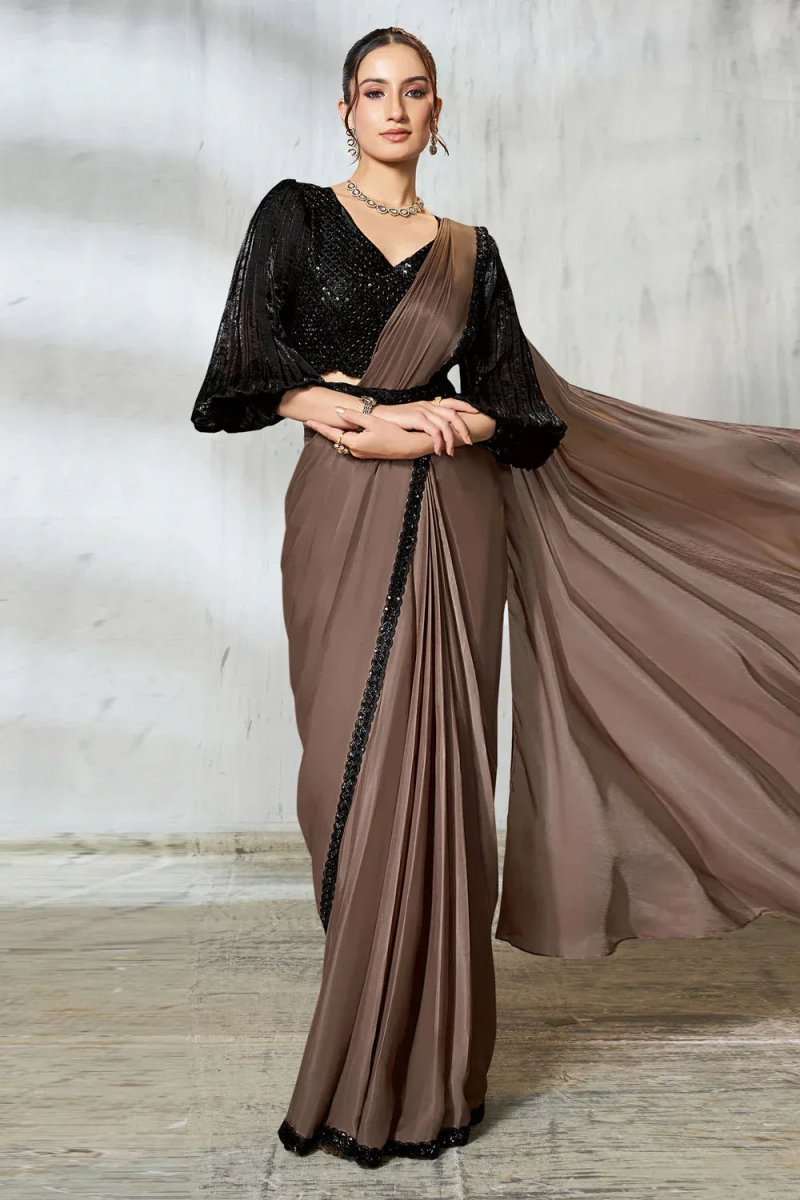 Ruffle saree in taupe with black sequined V-neck blouse and flowing pleated pallu