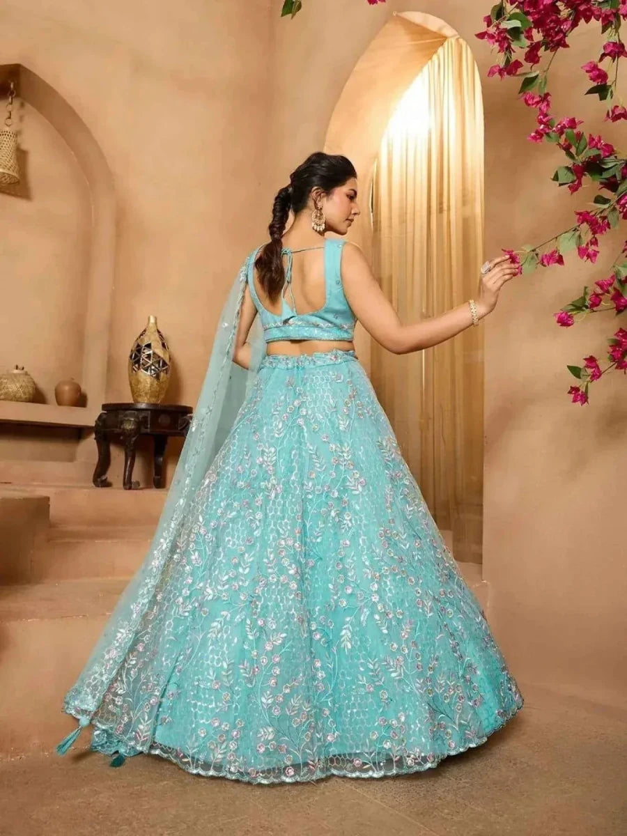 Sea green net lehenga with floral embroidery, tied back blouse and net dupatta