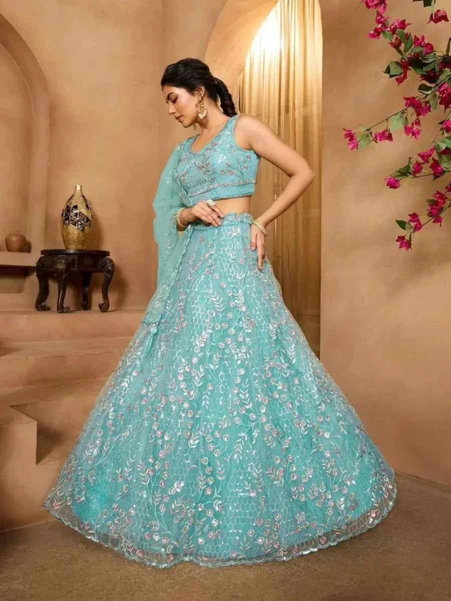 Sea green net lehenga with floral embroidery, flared skirt and sleeveless blouse