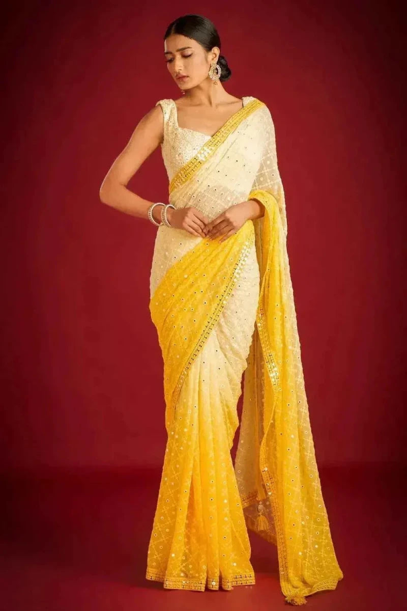 Yellow and cream sequin embroidered saree with contrast border, draped on model