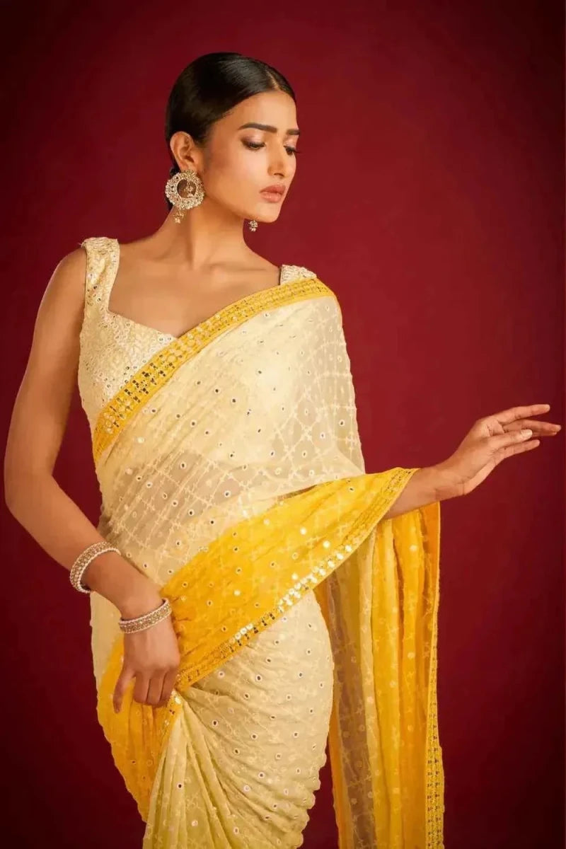 Yellow and cream sequin embroidered saree with beaded pallu and contrast border