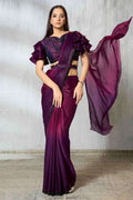 Wine purple satin silk saree with ruffled shoulder sleeves and pleated drape