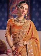 Orange embroidered tissue saree