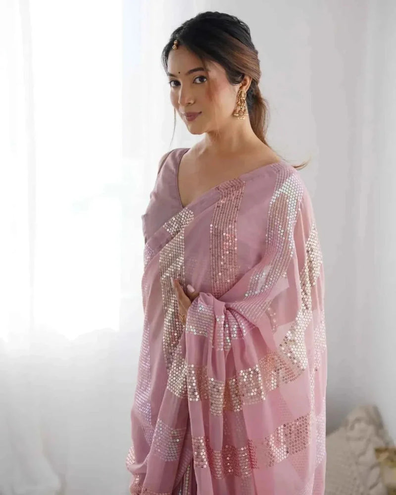 Pastel pink georgette saree with linear sequins on pallu and pleated drape