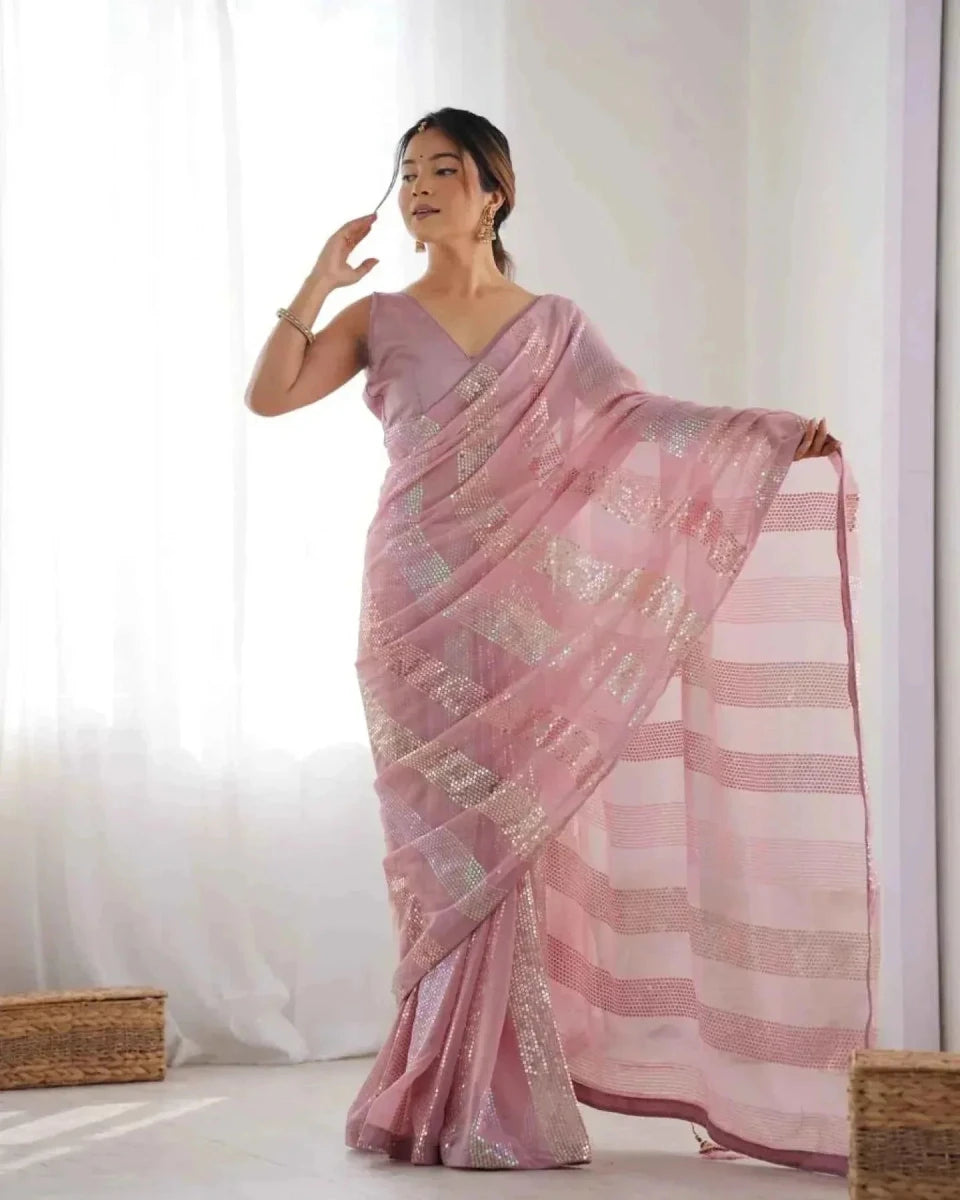 Pastel pink georgette saree with linear sequin embroidery and check-like sequined lines