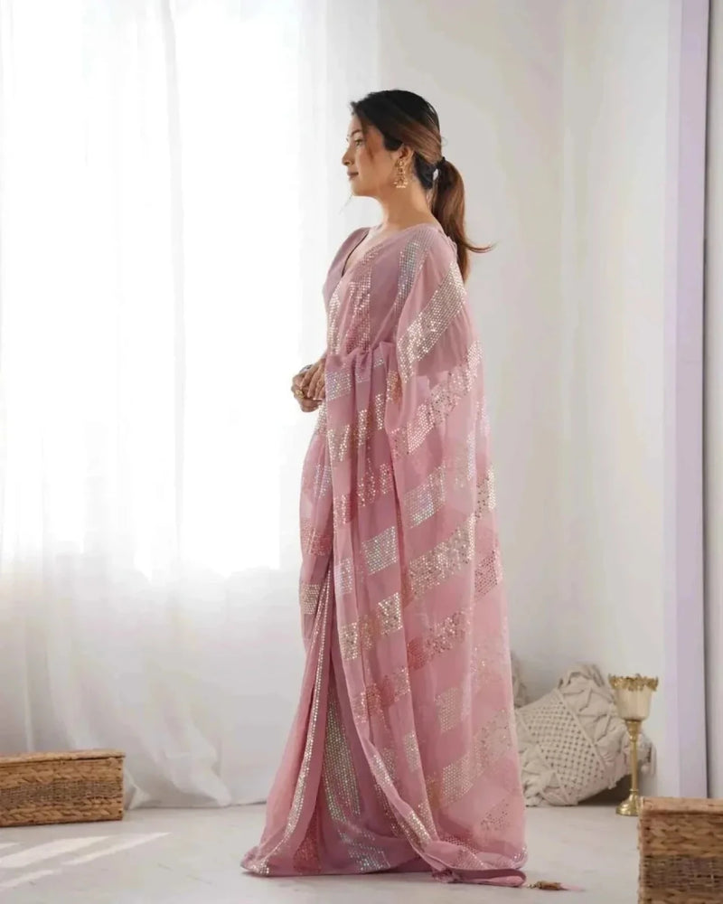 Pastel pink georgette saree back view with linear sequin embroidery in vertical panels