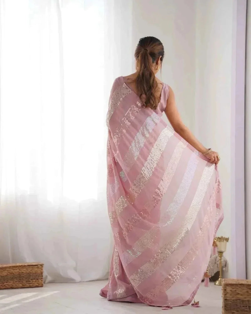 Pastel pink georgette saree from the back with linear sequins and drape folds