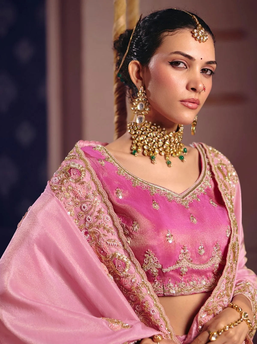 Pink tissue silk saree with beadwork and zari detailing