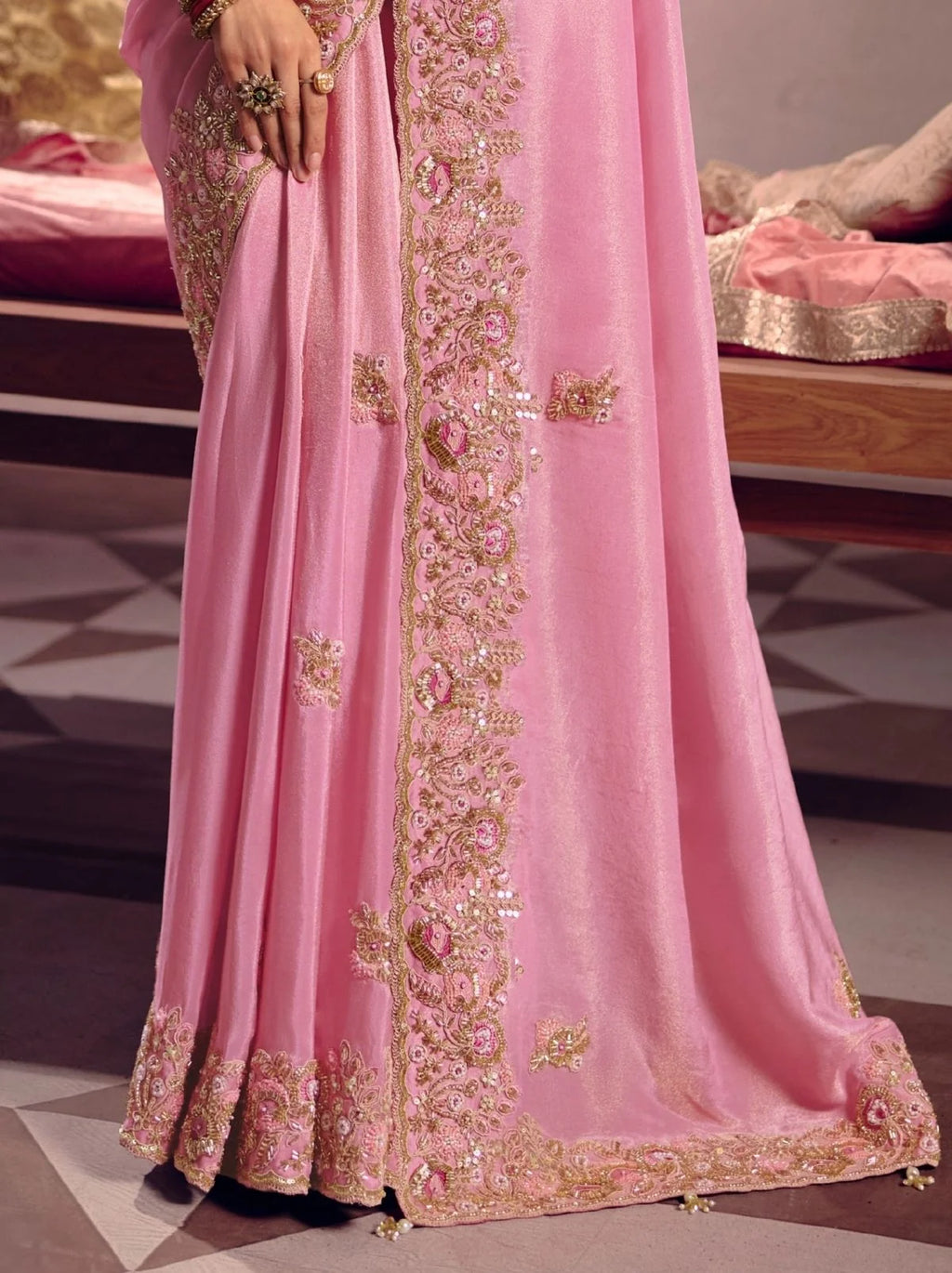 Pink tissue silk saree with beadwork and zari detailing