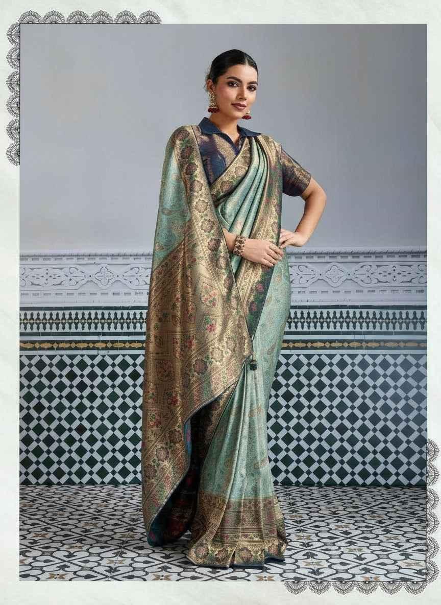 Woman wearing platinum blue and gold Kanjivaram silk saree with intricate meenakari zari brocade and collar blouse
