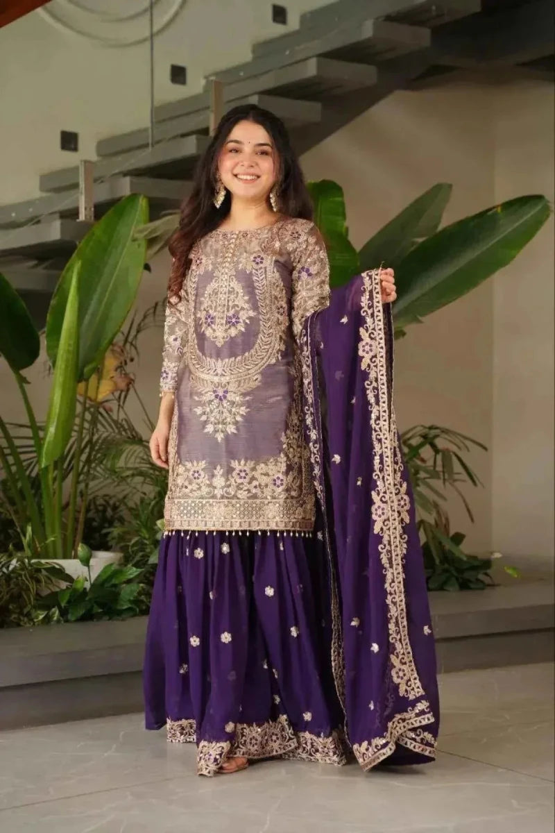 Purple sharara suit with gold-toned embroidery on tunic and skirt, paired with dark dupatta